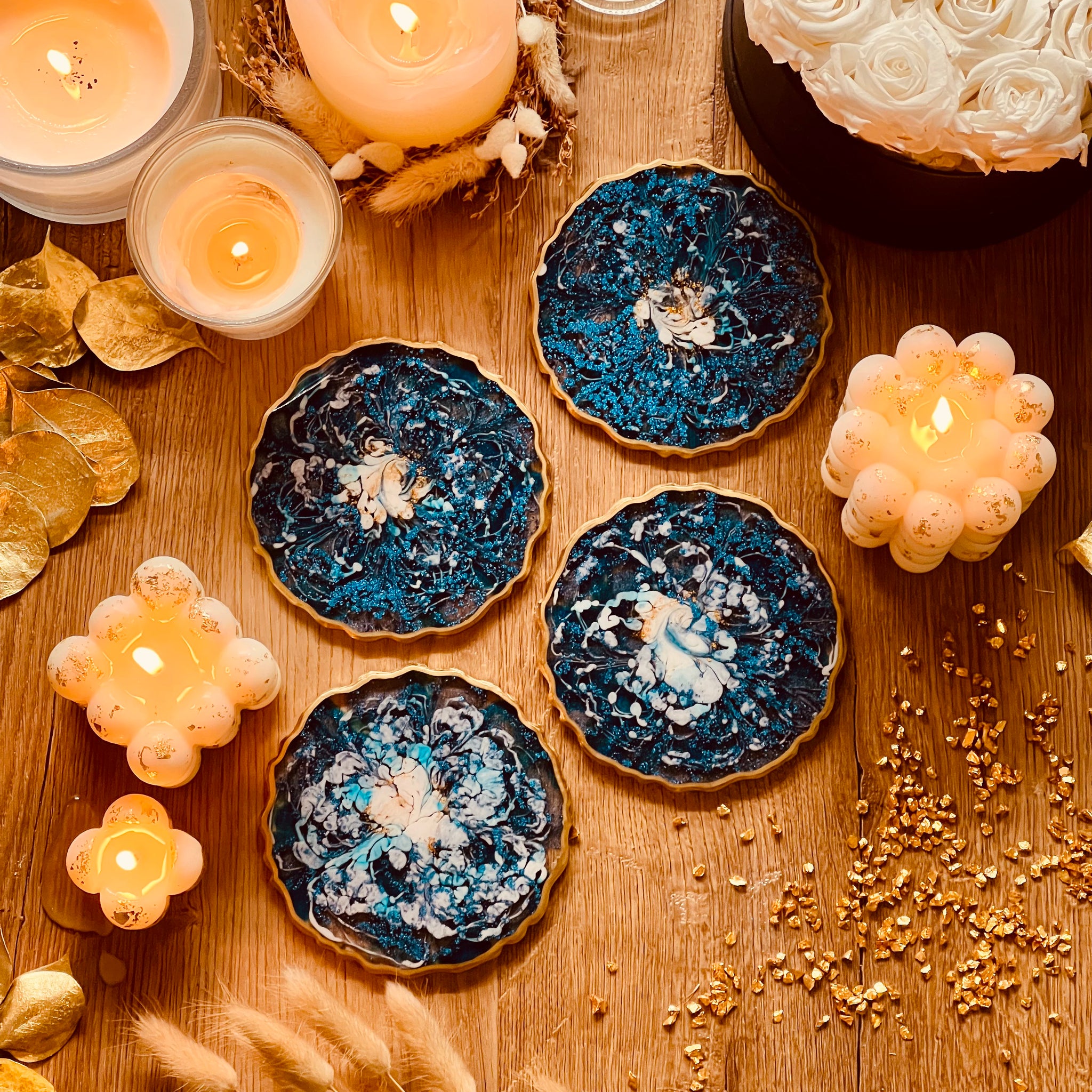 4 resin coasters in blue with gold