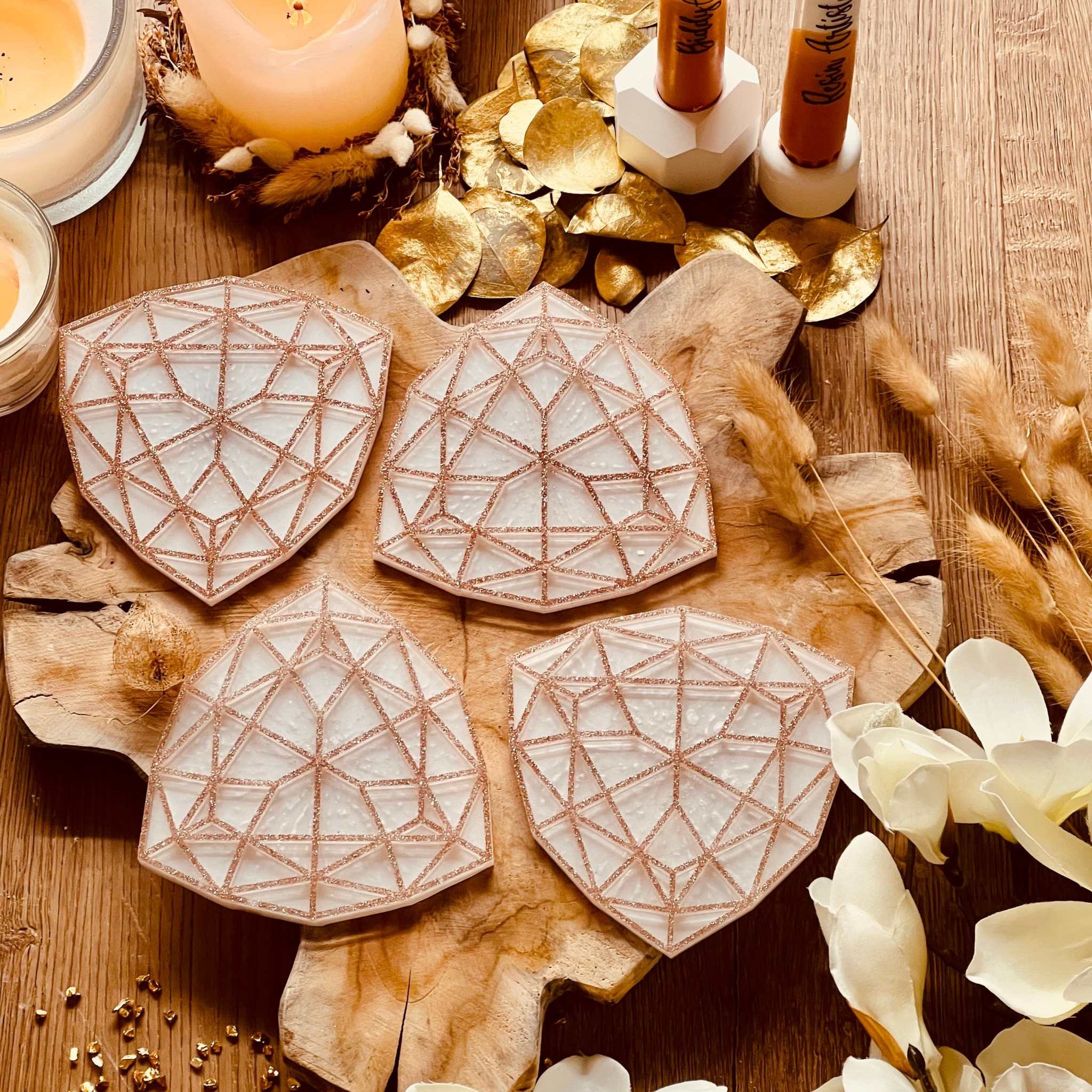 4 white resin coasters with gold 3D design