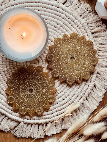 2 mandala coasters made of resin in gold