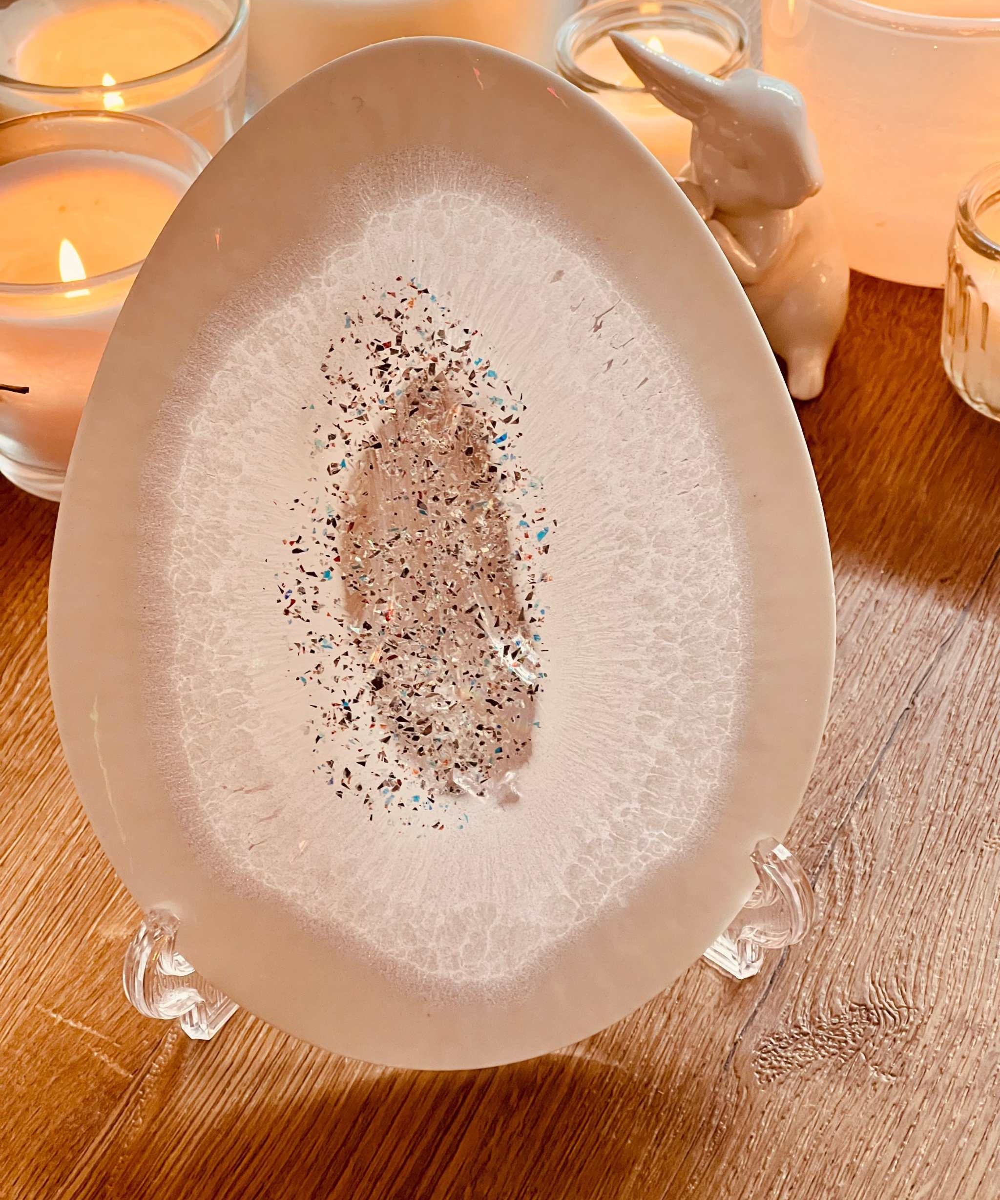 Handmade white resin Easter egg ornaments with silver and holographic surface.