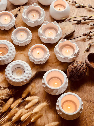 Cast ceramic tealight holders in various minimalist designs