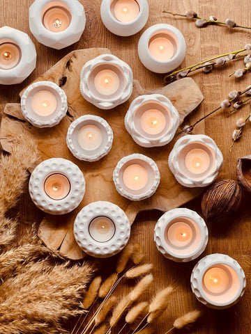 Cast ceramic tealight holders in various minimalist designs